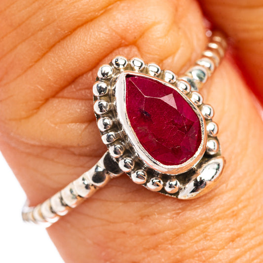 Sterling silver ring with red teardrop gemstone and beaded halo bezel