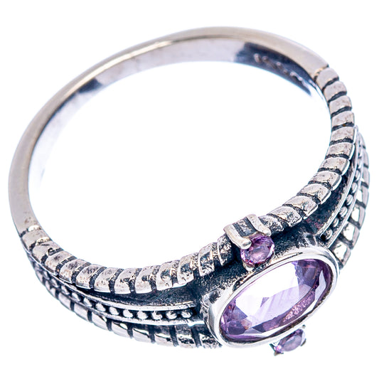 Sterling silver ring with oval amethyst accents on sculpted stacked bands, side view