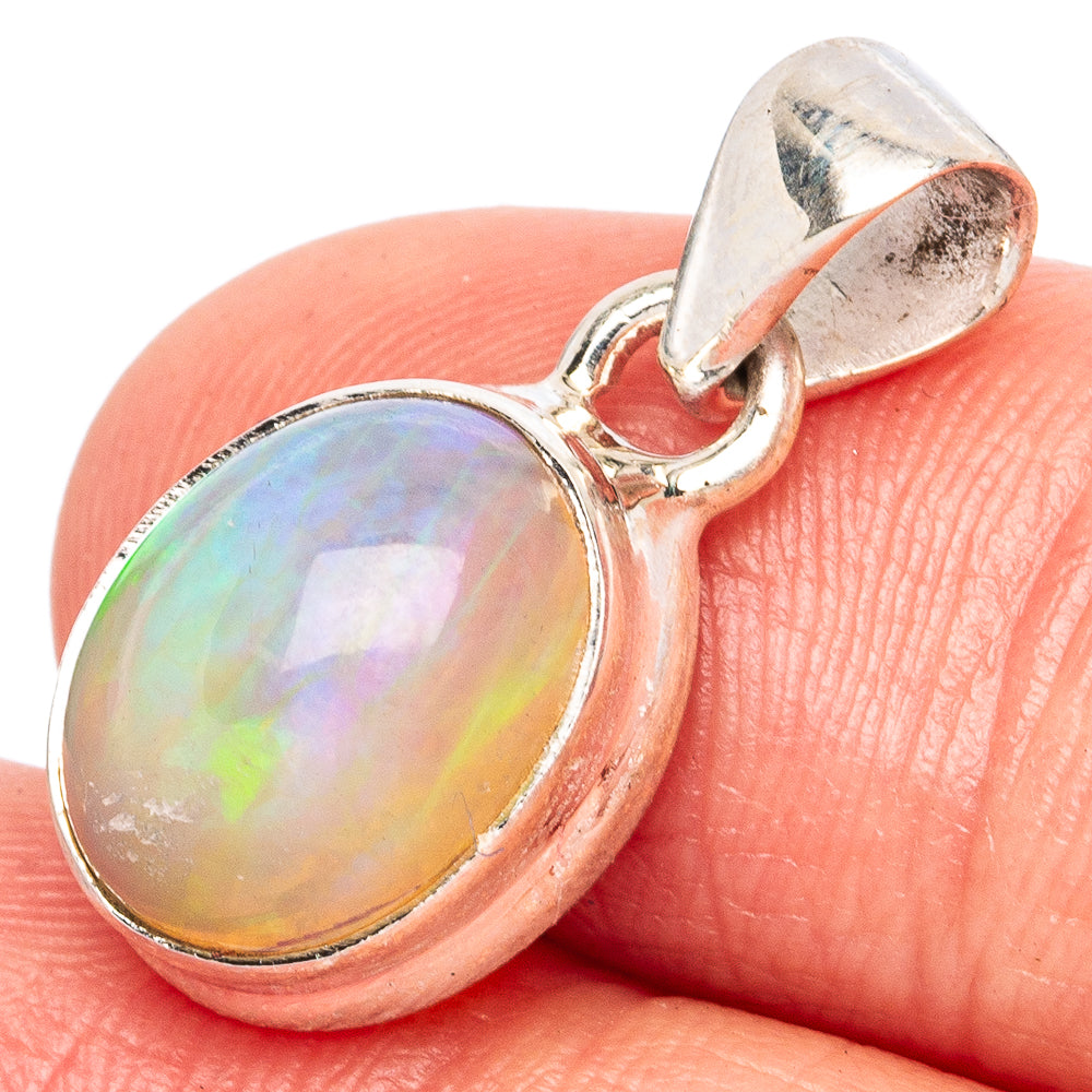 Oval Ethiopian opal pendant in polished 925 sterling silver, iridescent rainbow sheen