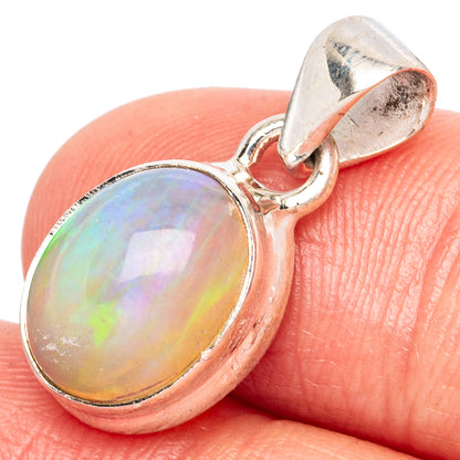 Oval Ethiopian opal pendant in polished 925 sterling silver, iridescent rainbow sheen