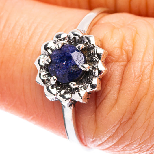 Sterling silver ring with oval blue sillimanite center and scalloped prong setting