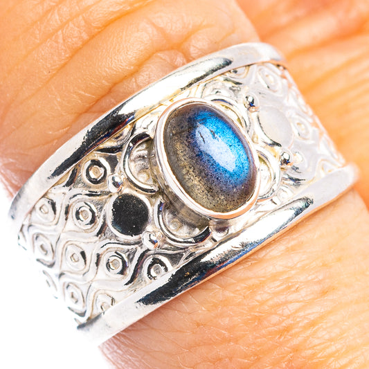 Sterling silver ring with oval blue-labradorite cabochon and ornate filigree setting
