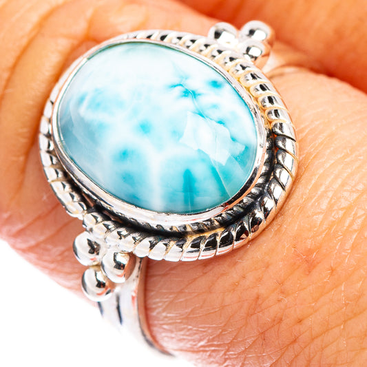 Oval turquoise-blue larimar cabochon sterling silver ring with ornate rope setting