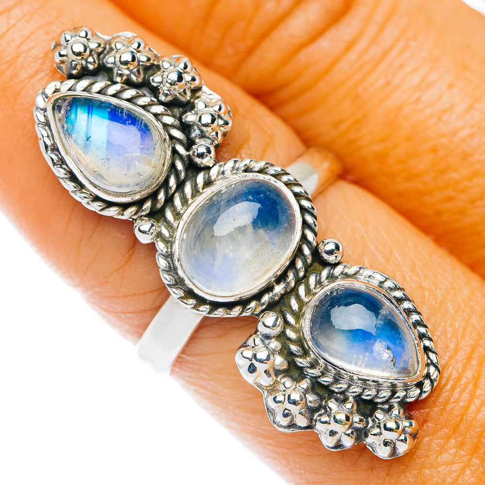 Sterling silver ring with three oval blue moonstone cabochons, ornate bezel