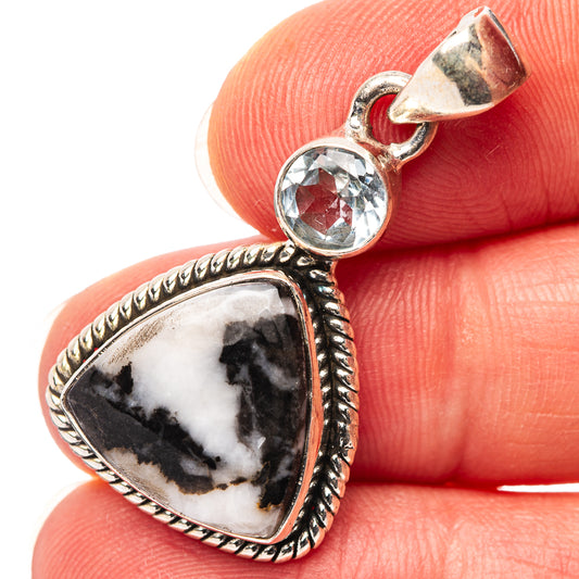 Sterling silver pendant with marbled white/black teardrop stone and round blue gemstone