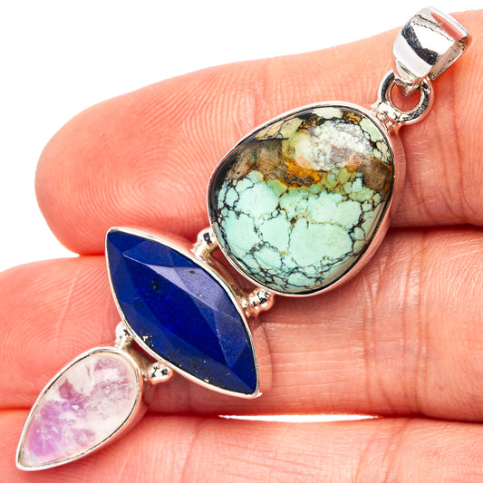 Sterling silver gemstone pendant with oval turquoise, blue lapis, and pink moonstone accents.