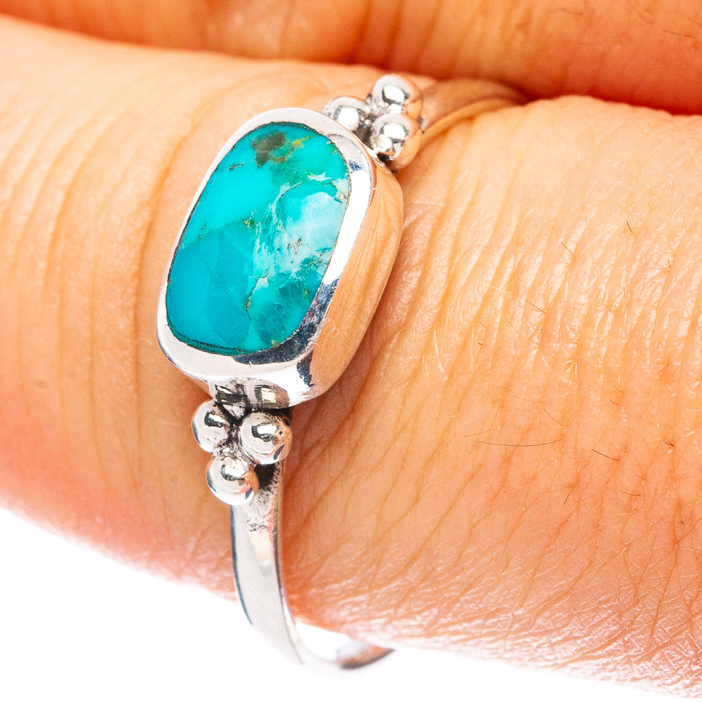 Sterling silver turquoise ring with oval cabochon and ornate side details