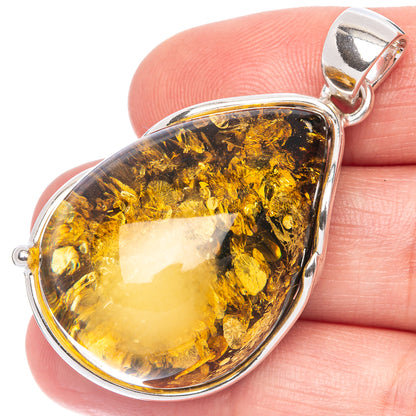 Silver pendant with teardrop amber resin stone, polished bail and frame