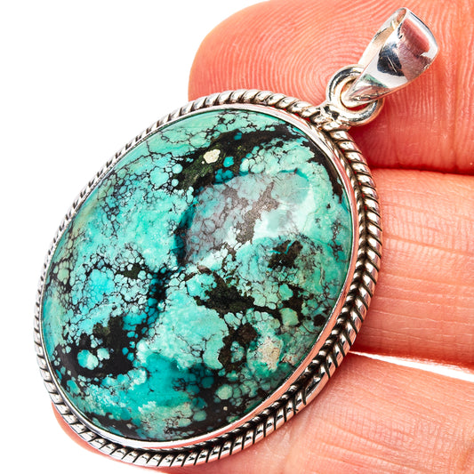 Turquoise oval pendant with .925 sterling silver bezel and bail, rope border.