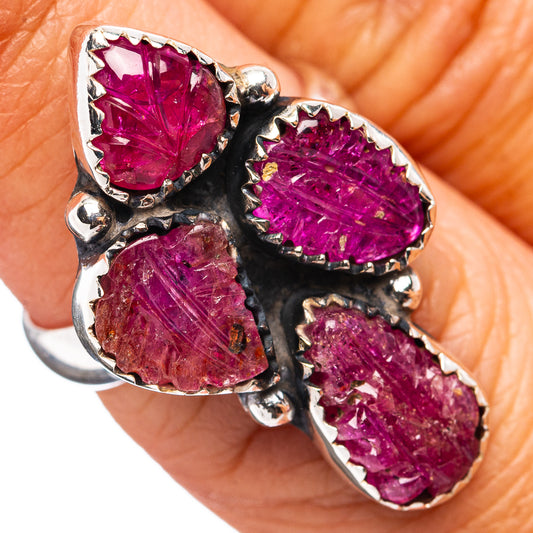 Sterling silver ring with three marquise pink-red ruby stones in dark prongs