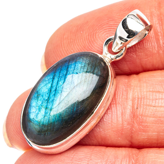 Oval labradorite cabochon pendant in .925 sterling silver bezel with bail
