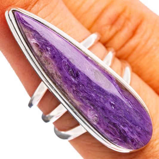 Sterling silver charoite ring, oval purple gemstone in polished bezel on hand