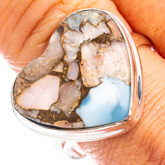 Heart-shaped gemstone ring with silver band; white, pink and blue turquoise stone inlay.