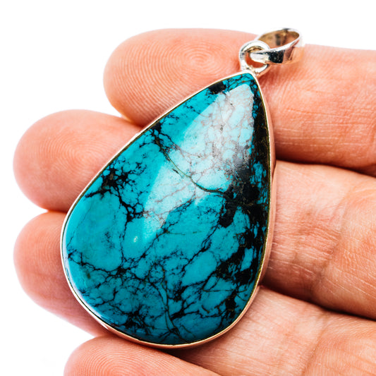 Turquoise teardrop pendant with .925 sterling silver bezel and loop bail