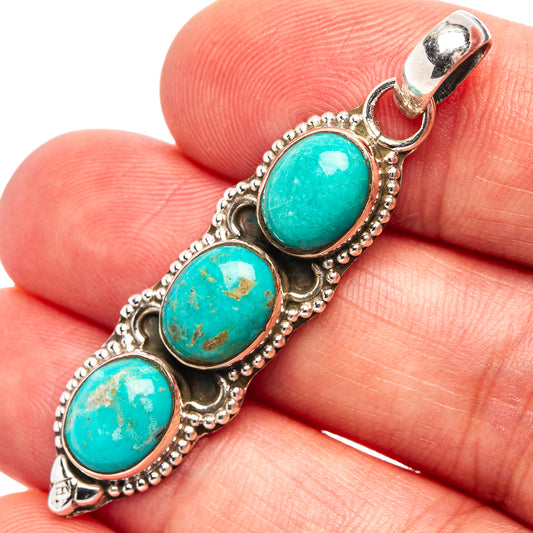 Turquoise oval pendant with three bezel-set stones, .925 sterling silver frame