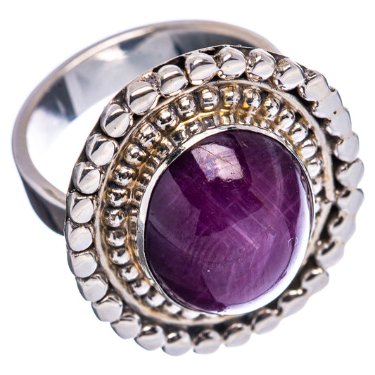 Sterling silver oval purple gemstone ring, angled view, beaded outer border