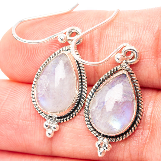 Sterling silver teardrop moonstone earrings with rainbow sheen, ornate bezel and hooks