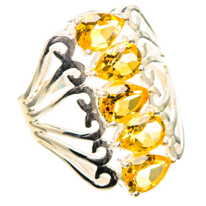 Sterling silver ring with three oval faceted yellow stones and leaf-like openwork sides