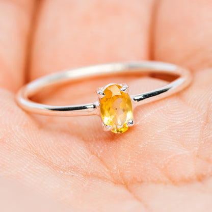 Sterling silver stackable ring with oval yellow citrine gemstone, smooth band