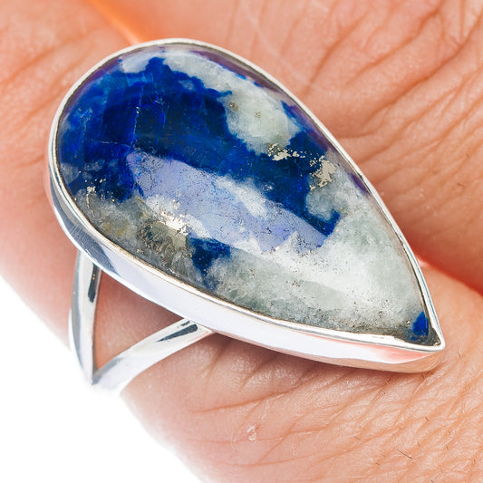 Sterling silver ring with teardrop blue gemstone, open bezel, detailed band