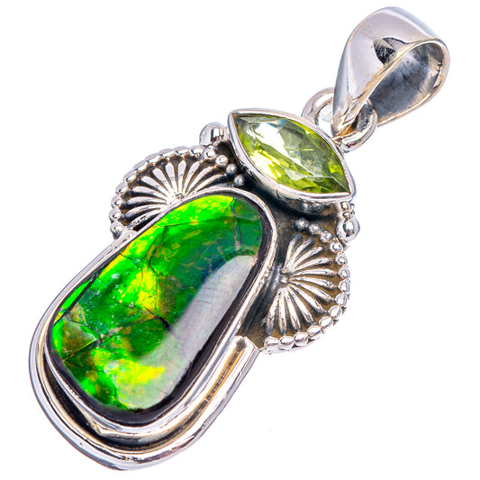 Sterling silver pendant with green ammolite cabochon and sunburst bezel, top loop