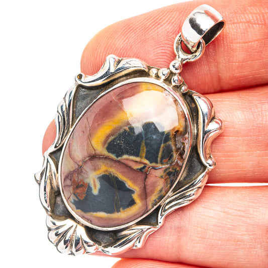 Oval butterfly jasper pendant in .925 sterling silver bezel, with leaf-like frame