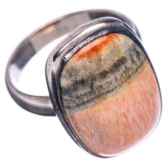 Sterling silver oval cabochon ring, side view of mottled gray and orange stone