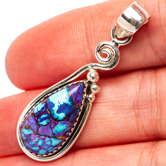 Purple turquoise inlay teardrop pendant with silver bail and curled link detail.