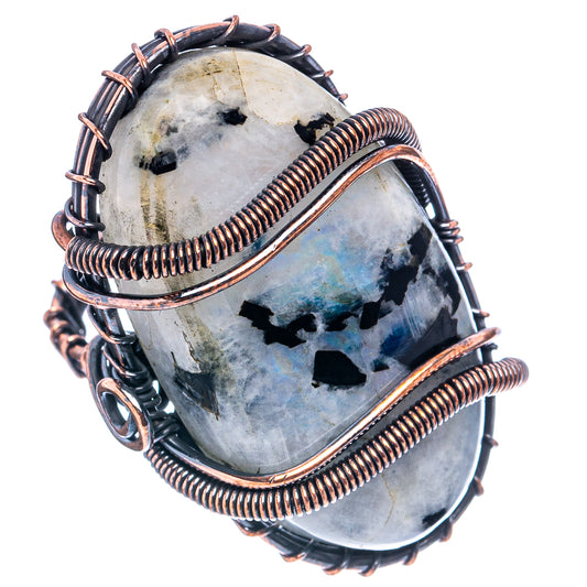 Oxidized copper wire-wrapped moonstone ring, front view of oval cabochon with blue flashes