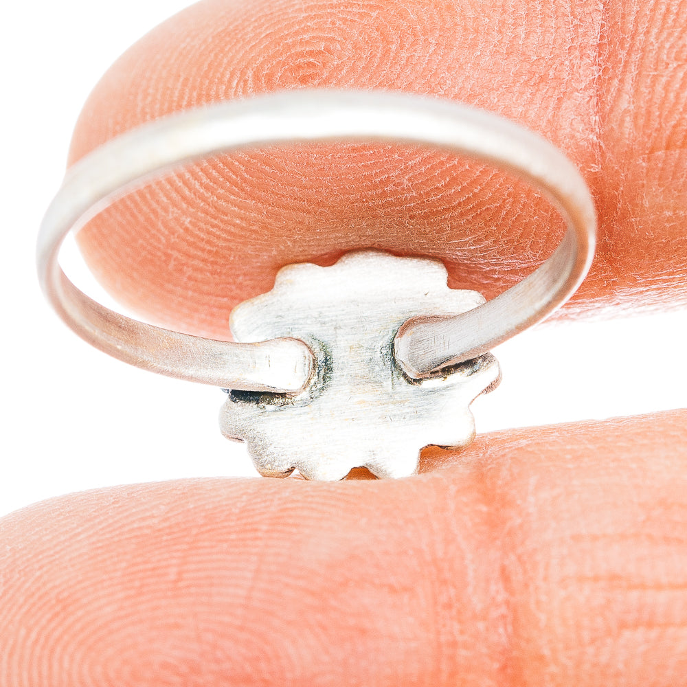 Sterling silver ring with engraved side profile and raised bezel setting