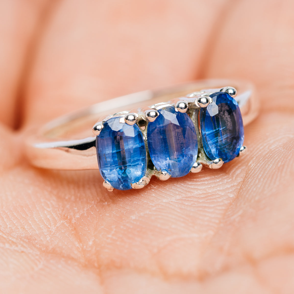 Three-stone kyanite ring in 925 sterling silver, blue oval gems on band