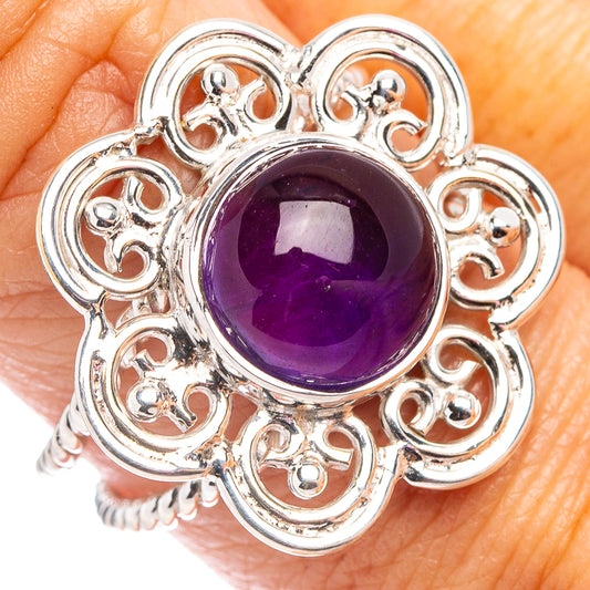 Sterling silver amethyst ring with oval purple gemstone and ornate heart filigree