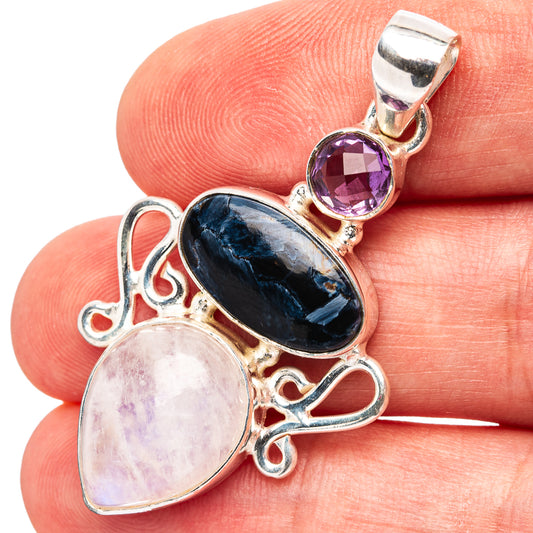 Sterling silver pendant with amethyst, pale pink moonstone, and dark oval gemstone