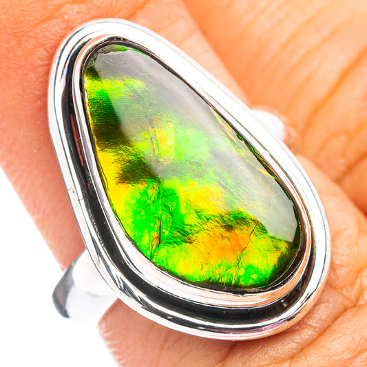 Sterling silver ammolite ring with oval iridescent green and yellow stone, polished band