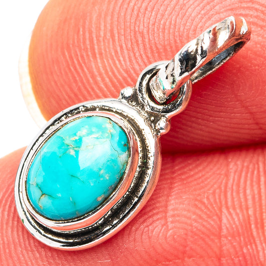 Turquoise oval pendant with oval bezel and 925 sterling silver bail, close-up