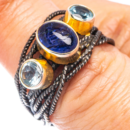 Braided silver-tone bracelet with oval blue gemstone and faceted clear stones