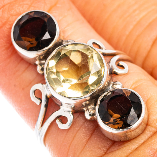 Sterling silver three-stone ring with round smoky and lemon quartz, faceted gemstones