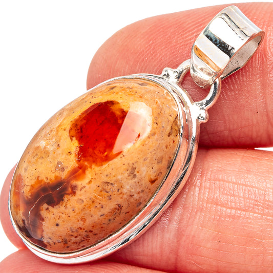 Fire opal pendant in sterling silver, oval amber-orange stone with red center