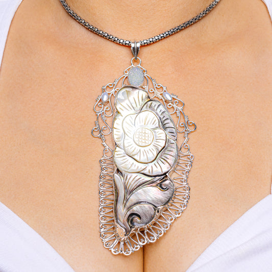 925 sterling silver mother-of-pearl pendant with ornate filigree oval drop