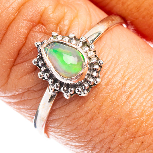 Oval Ethiopian opal ring in .925 sterling silver, beaded halo and curved band