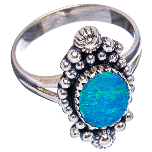 Sterling silver opal ring with round blue-green center, bead and filigree bezel