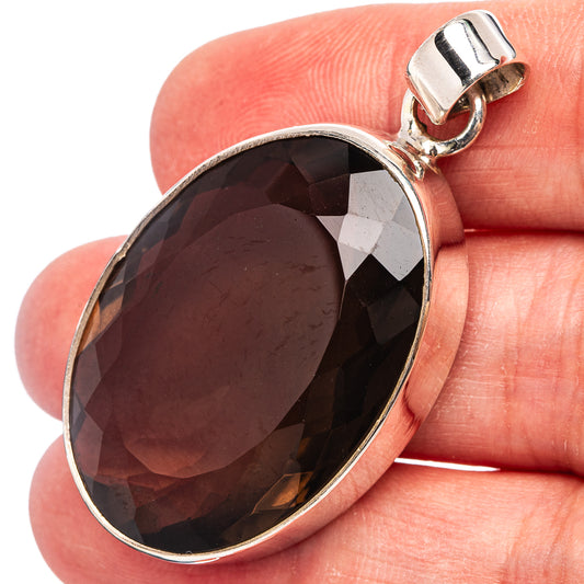 Oval smoky quartz pendant in .925 sterling silver bezel, dark faceted stone close-up