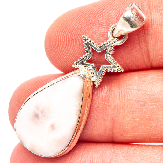 Sterling silver star pendant with pink teardrop gemstone, bail on top