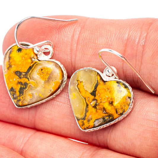Heart jasper drop earrings, yellow-orange marbled stone with silver bezel and hooks.