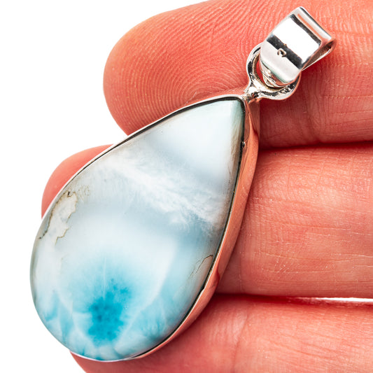 Close-up Larimar teardrop pendant with .925 sterling silver bezel, marbled blue stone