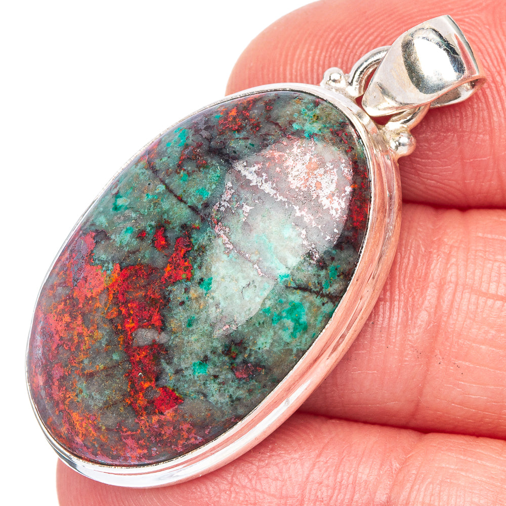 Oval Sonora sunrise stone pendant in 925 sterling silver, shown close-up on finger