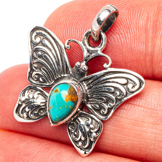 Turquoise butterfly pendant in .925 sterling silver with oval blue-green gemstone