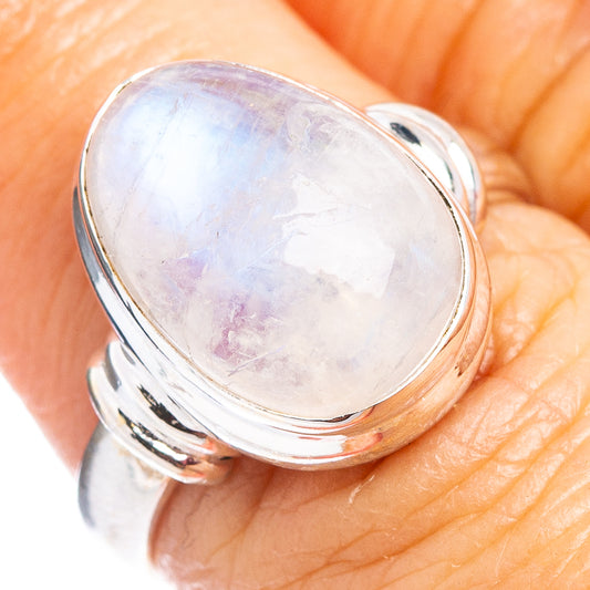 Sterling silver oval moonstone ring with bezel setting, close-up of gemstone