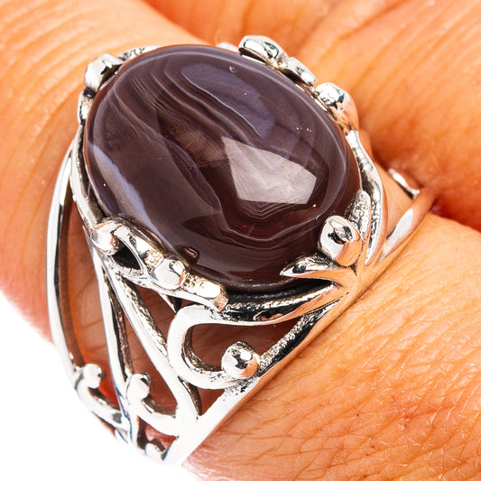 Dark oval agate cabochon ring in .925 sterling silver with ornate silver setting