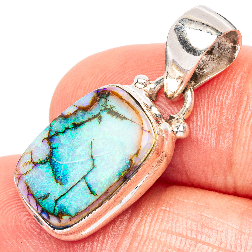 Sterling silver opal pendant with oval cabochon, rainbow blue-green gemstone.